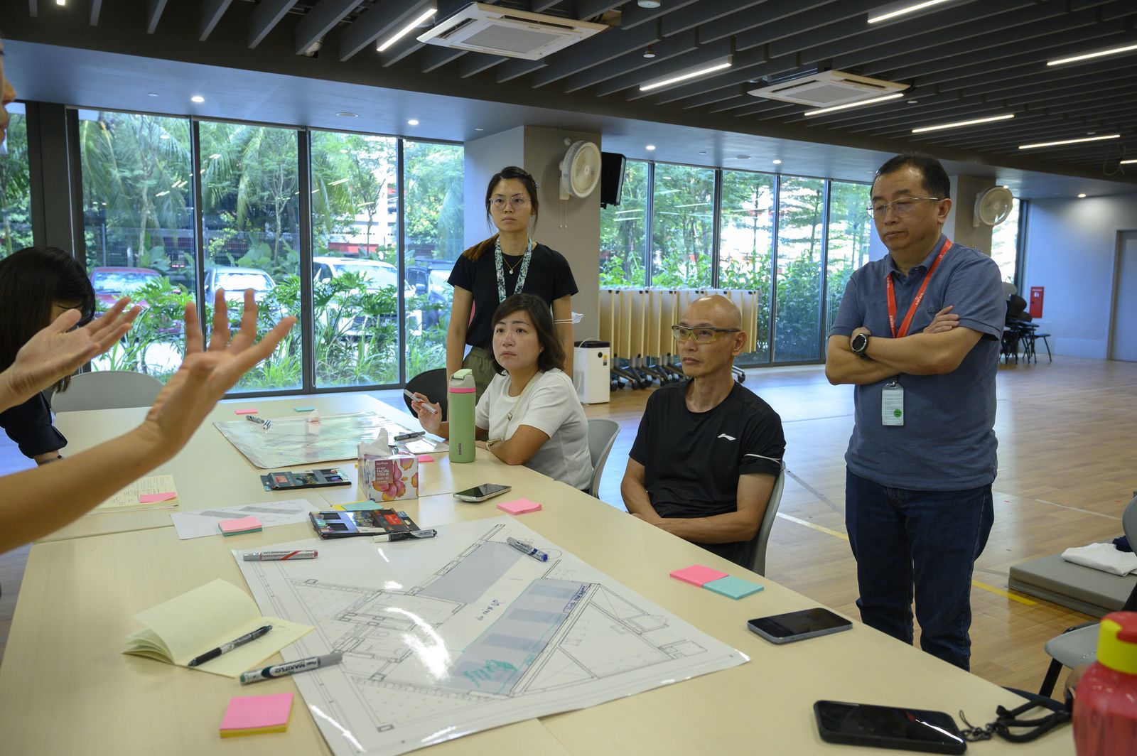 The wider group discussing ideas around the table