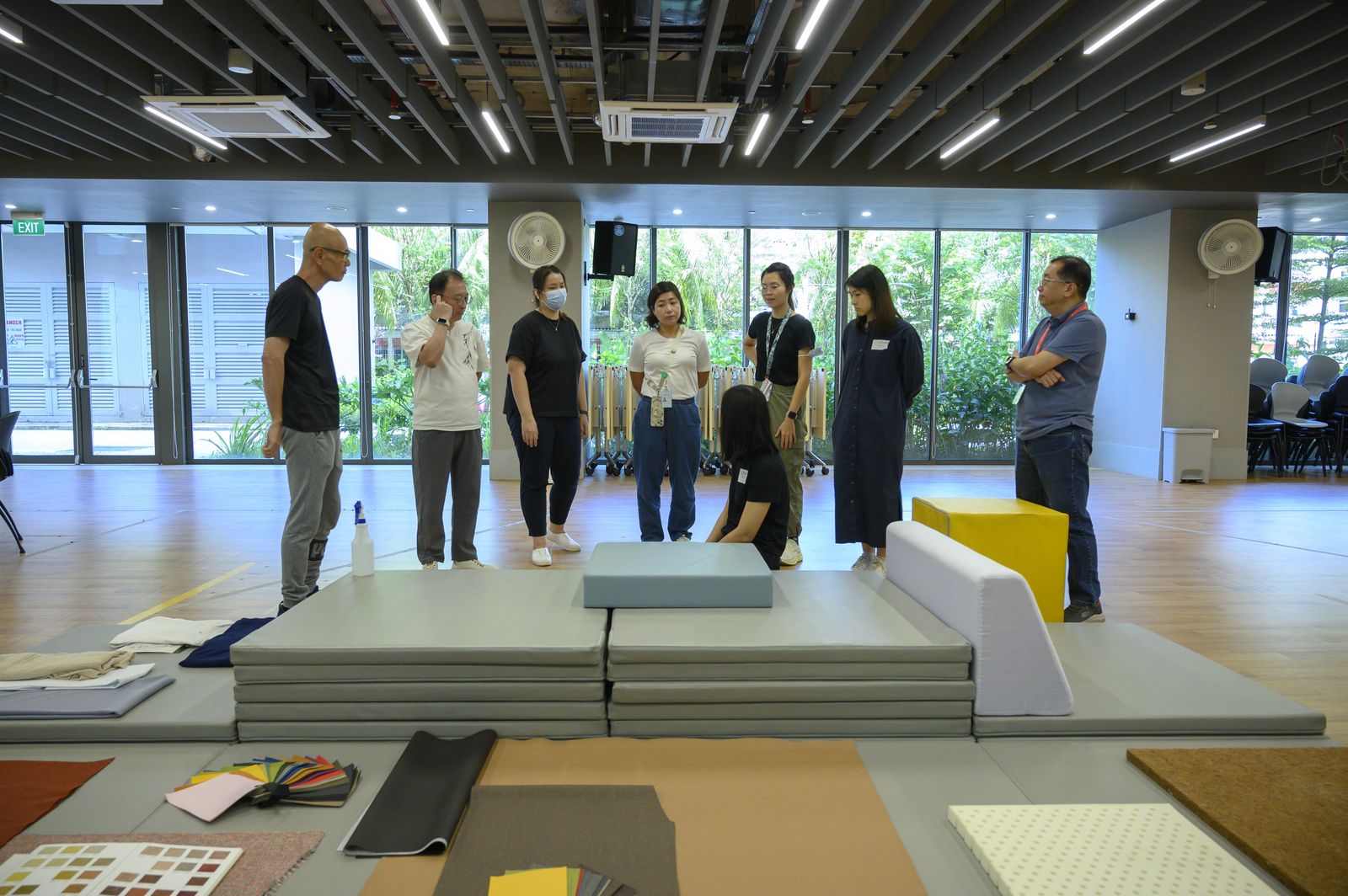 Staff gathered around stacked foam prototypes