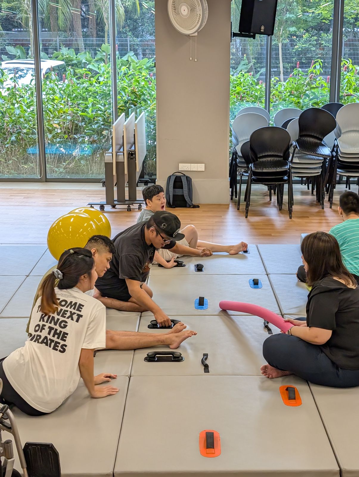 Residents and staff testing grab handles along the floor